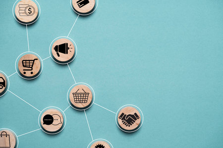 A creative network of icons representing various aspects of e-commerce including shopping carts communication and transactions all set against a soothing blue background.の写真素材
