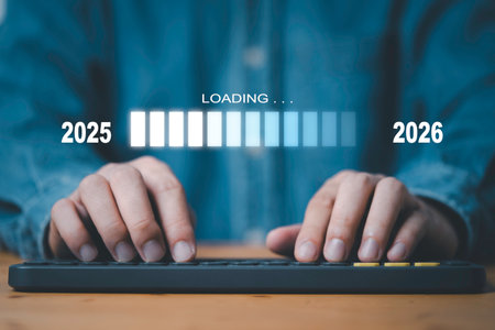 Businessman using computer keyboard with update technology downloading tool bar status from 2025 to 2026の写真素材