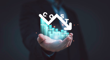 Businessman hand holding digital graph with cost reduction concept showing financial growth saving...