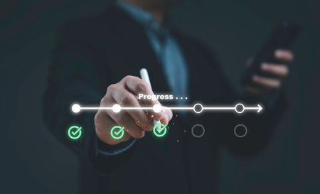 Businessman hand drawing progress timeline with checklist icons symbolizing project management workflow milestones business success planning strategy and digital growthの写真素材