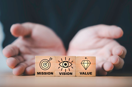 Mission vision and value concept showing wooden blocks with business icons representing corporate goal leadership inspiration success direction strategy and organizational development for growthの写真素材