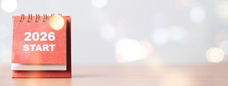 A desk calendar showing 2026 start with soft bokeh light representing the new year concept fresh beginnings annual planning motivation and inspiration for future goals and positive direction.の写真素材