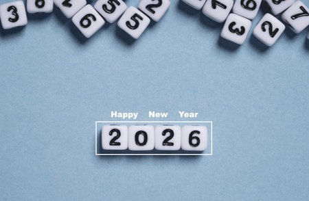 White cube blocks showing 2026 with Happy New Year text above on a minimal background for new year...