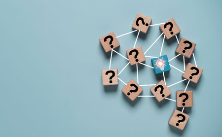 Problem solving concept with connected question mark icons and central light bulb symbolizing innovation, critical thinking and idea generation. Business brainstorming and strategic solution network.の写真素材