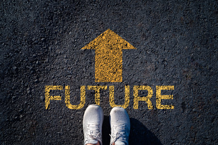 Future career direction concept with yellow arrow and word future on asphalt road. Personal growth...