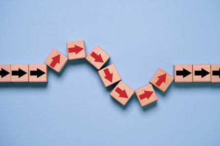 Wooden arrow blocks changing direction in zigzag path, symbolizing business strategy, adaptability, problem solving, process improvement, workflow change, and overcoming challenges.