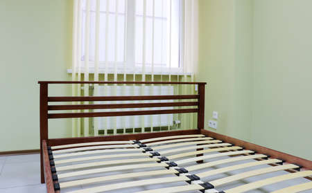 lacquered red wooden double bed with orthopedic slatsの写真素材