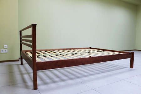 lacquered red wooden double bed with orthopedic slatsの写真素材
