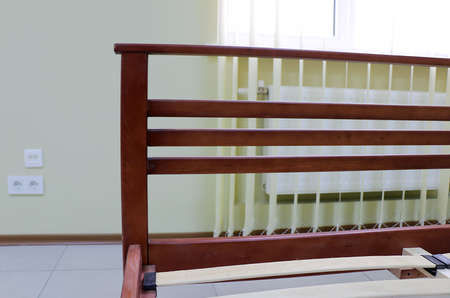 lacquered red wooden double bed with orthopedic slatsの写真素材