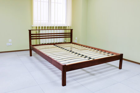 lacquered red wooden double bed with orthopedic slatsの写真素材