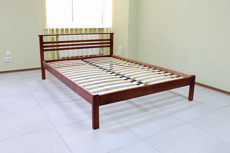 lacquered red wooden double bed with orthopedic slatsの写真素材
