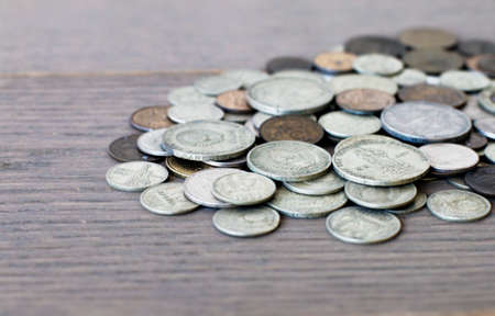 old coins, commemorative coins of the USSR, against the background of an old boardの写真素材