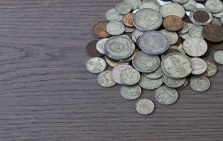 old coins, commemorative coins of the USSR, against the background of an old boardの写真素材