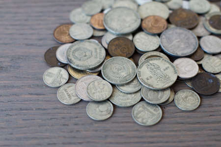 old coins, commemorative coins of the USSR, against the background of an old boardの写真素材