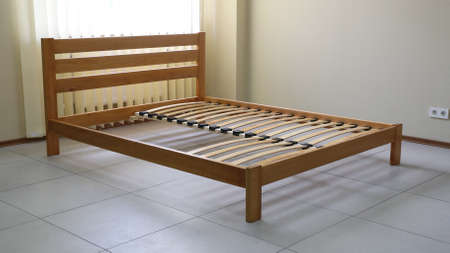 double bed frame in lacquered wood with slatsの写真素材