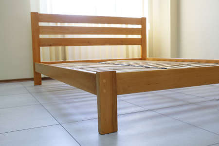 double bed frame in lacquered wood with slatsの写真素材