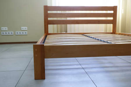 double bed frame in lacquered wood with slatsの写真素材
