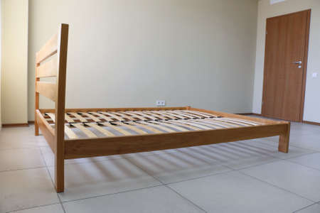 double bed frame in lacquered wood with slatsの写真素材