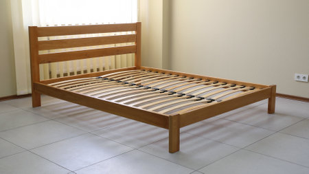 double bed frame in lacquered wood with slatsの写真素材
