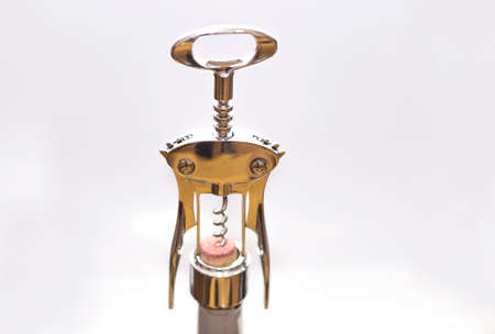 corkscrew with wine corks, on an isolated background