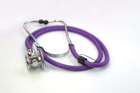 medical stethoscope purple color, on a white backgroundの写真素材