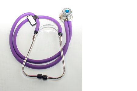 medical stethoscope purple color, on a white backgroundの写真素材