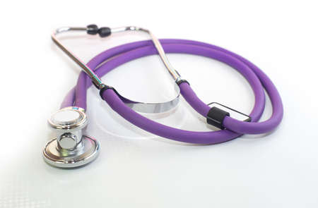 medical stethoscope purple color, on a white backgroundの写真素材