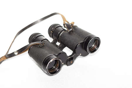 old binoculars with strap on white backgroundの写真素材