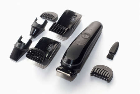 A set of the cordless electric hair clipper isolated on the white background