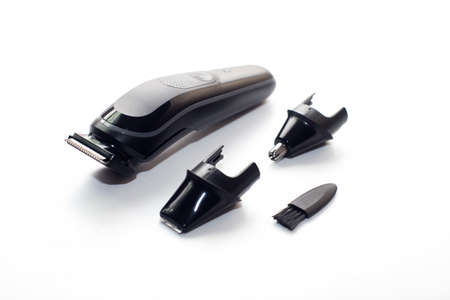 A set of the cordless electric hair clipper isolated on the white backgroundの写真素材