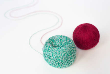 two skeins of multicolored wool yarn on an isolated white background. close-upの写真素材