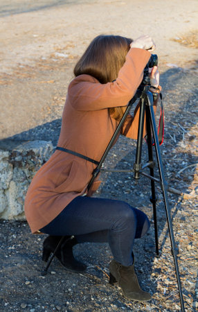 girl photographer shoots a landscapeの写真素材