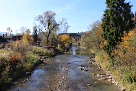 train on a bridge over a mountain river. Carpathians, Ukraineの写真素材