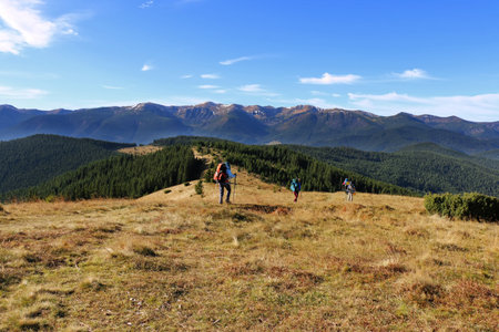 tourists with equipment go along the mountain ranges. Carpathians, Ukraineのeditorial素材