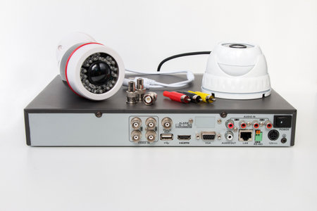 video surveillance cameras and video receiver on isolated white background. The concept of services for the installation of CCTV.の写真素材