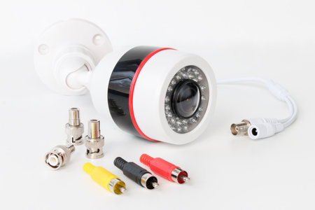 video surveillance camera and adapters for transmitting analog video on a white background. The concept of services for the installation of video surveillanceの写真素材