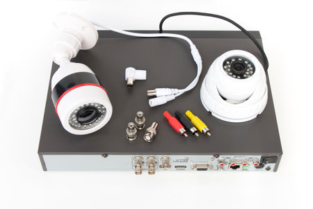 video surveillance cameras and video receiver on isolated white background. The concept of services for the installation of CCTV.の写真素材