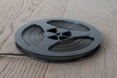 reel of magnetic tape from a vintage audio tape recorder, close-upの写真素材