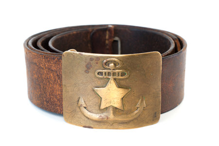 vintage leather military sailor belt with brass buckle, on isolated whiteの写真素材