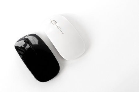 black and white optical wireless mouse isolated on white backgroundの写真素材