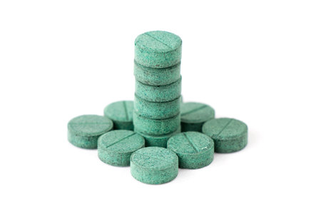 natural green algae pills, drugs and supplements, healthcare and pharmaceutical industry conceptの写真素材