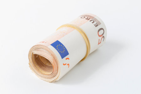 rolled up money, 50 euro banknote isolated on white backgroundの写真素材