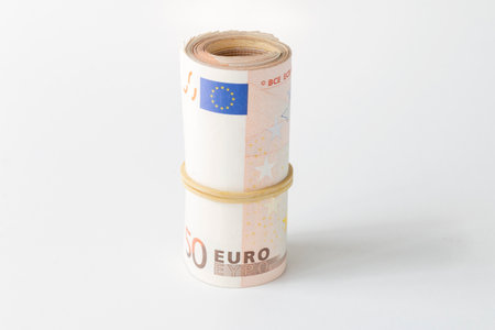 rolled up money, 50 euro banknote isolated on white backgroundの写真素材