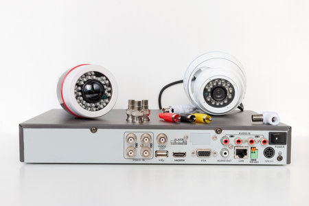 video surveillance cameras and video receiver on isolated white background. The concept of services for the installation of CCTV.の写真素材