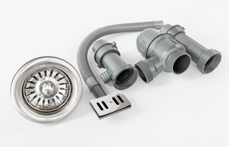 New plastic kitchen siphon isolated on white backgroundの写真素材