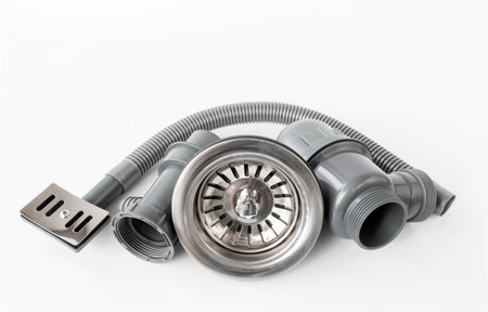 New plastic kitchen siphon isolated on white backgroundの写真素材