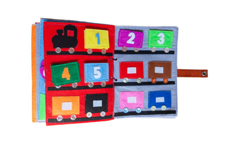 open sewn rag children's book, on a isolated backgroundの写真素材