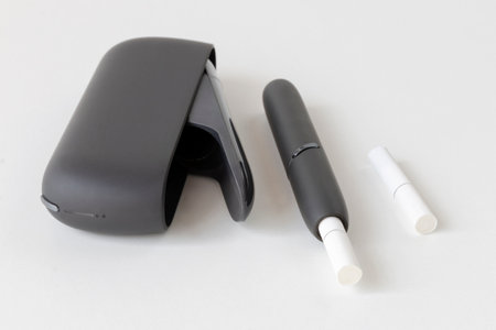tobacco heating device on a white surface, an alternative to traditional cigarettesの写真素材
