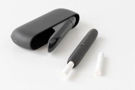 tobacco heating device on a white surface, an alternative to traditional cigarettesの写真素材