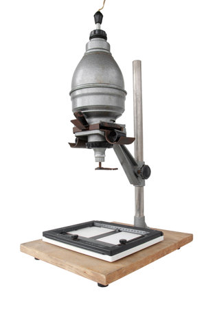 Vintage photographic enlarger for projecting photo negatives, isolated on white backgroundの写真素材